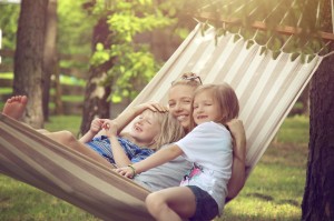 Family sitting in hammock - Mosquito free