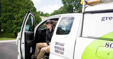 pest control technician in truck at customer home