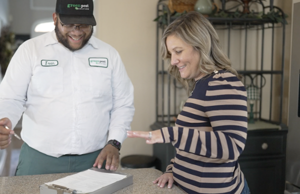 pest technician with customer